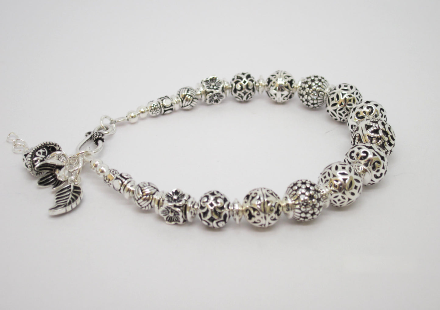 Sterling Silver Beaded Charm Bracelets, inspired by ancient Feng Shui principles, designed to attract wealth, prosperity, and good fortune