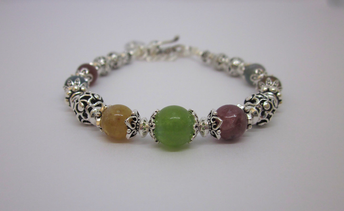 Handmade Multi-Tourmaline Sterling Silver Bracelet: Adjustable Length, Unique Charms