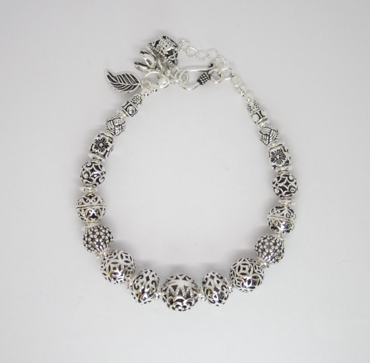 Sterling Silver Beaded Charm Bracelets, inspired by ancient Feng Shui principles, designed to attract wealth, prosperity, and good fortune