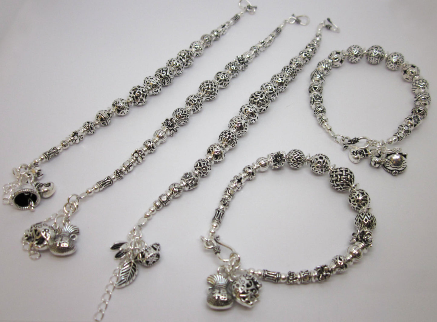 Sterling Silver Beaded Charm Bracelets, inspired by ancient Feng Shui principles, designed to attract wealth, prosperity, and good fortune