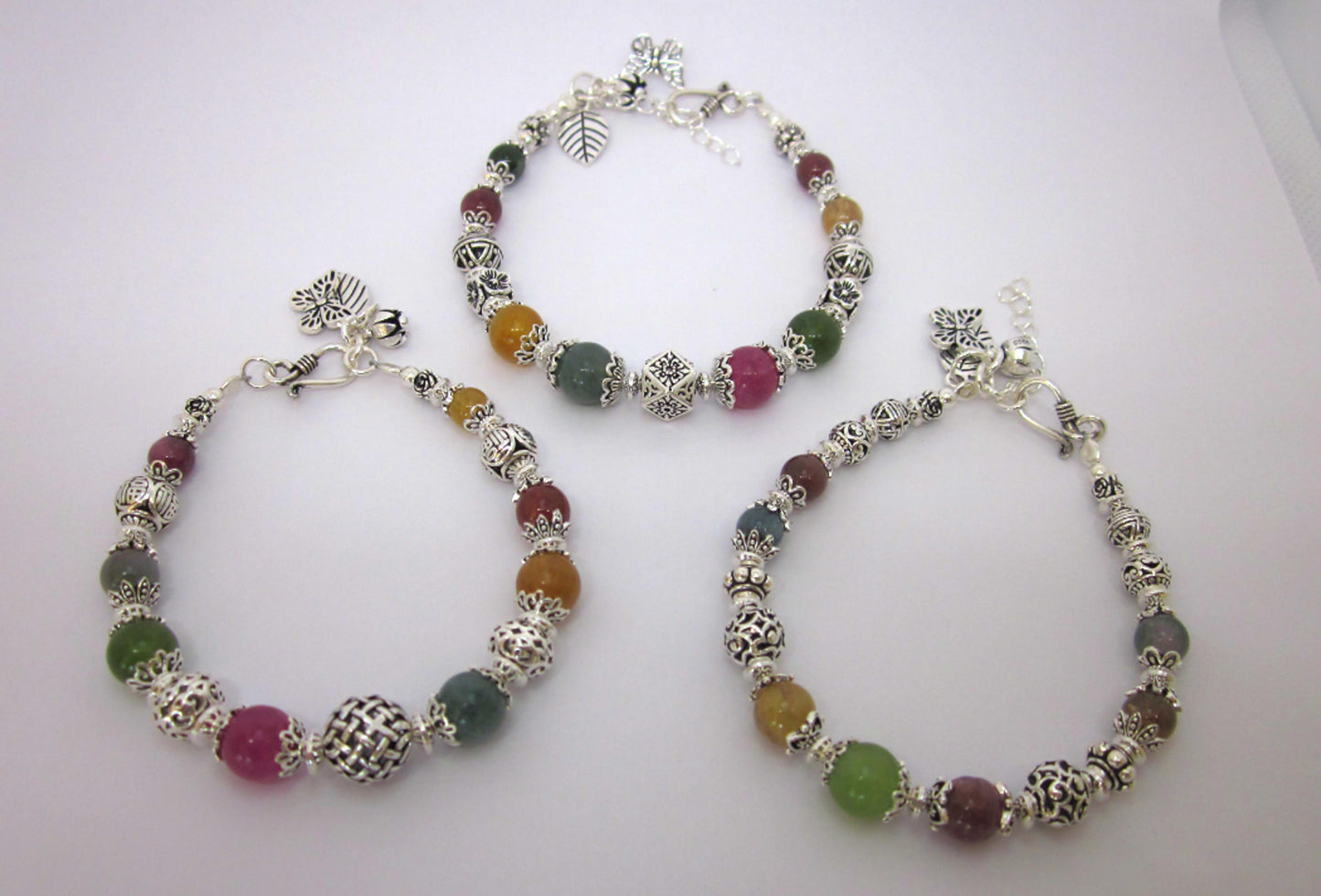 Handmade Multi-Tourmaline Sterling Silver Bracelet: Adjustable Length, Unique Charms